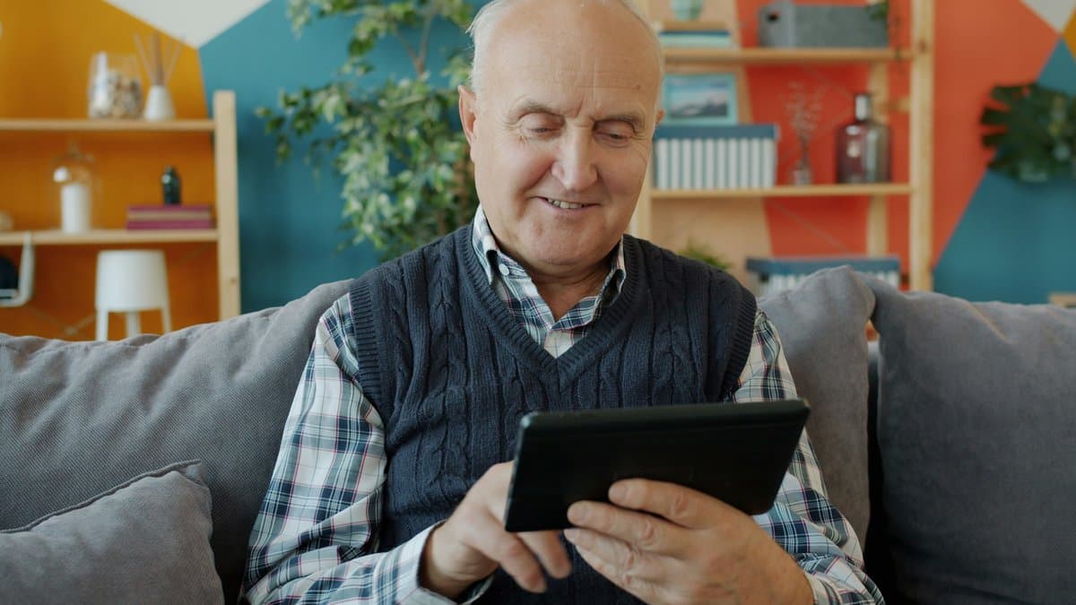 A caregiver engaging warmly with a senior client in their home