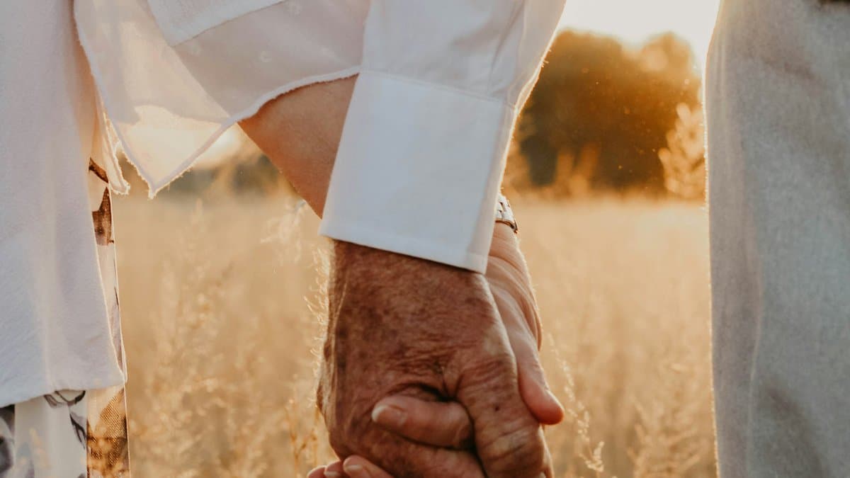 A caregiver helping a senior with daily activities at home